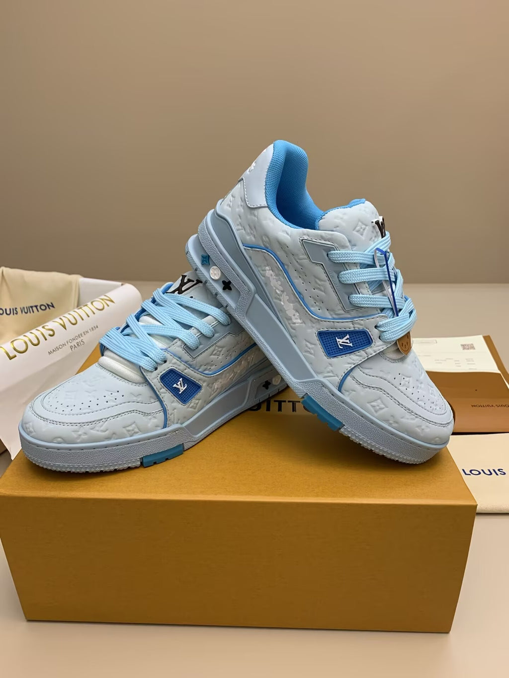 White and light blue sneakers with patterned upper