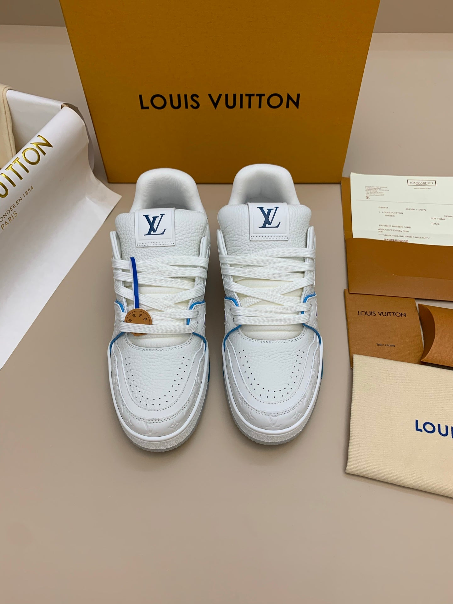White Low-Top Sneakers with Blue Trim