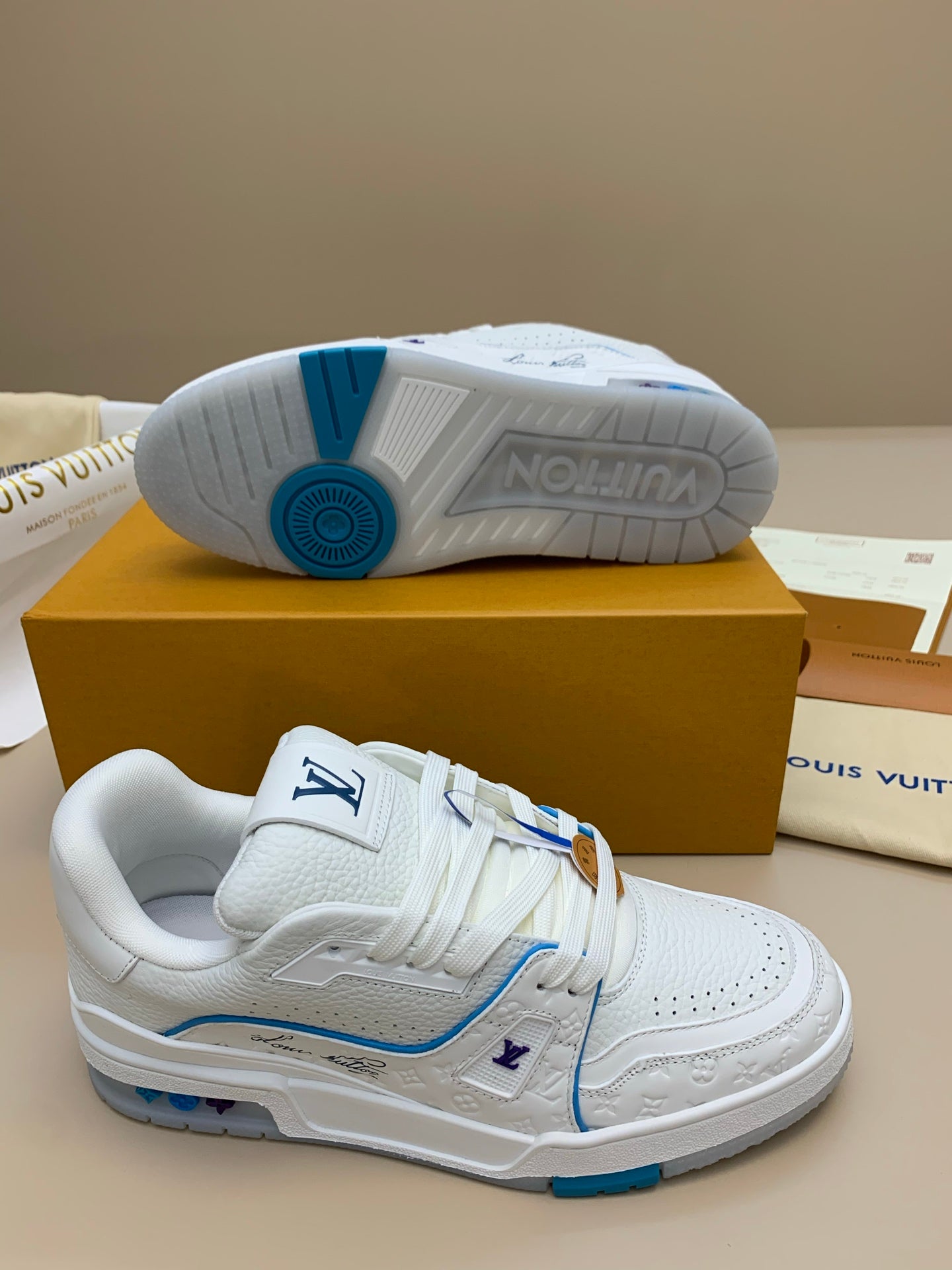 White Low-Top Sneakers with Blue Trim