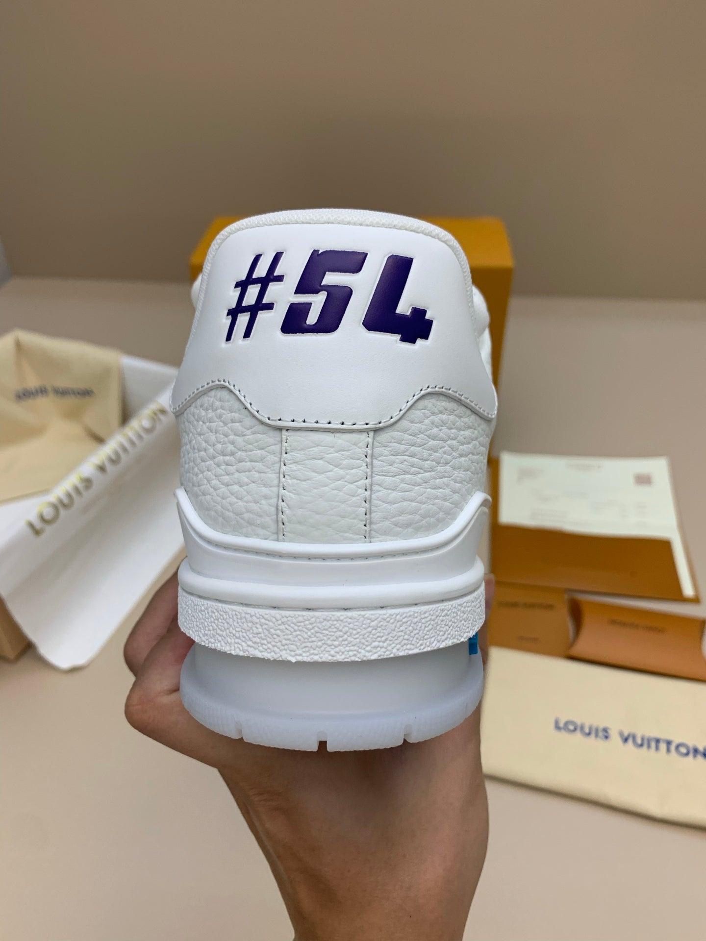 White Low-Top Sneakers with Blue Trim