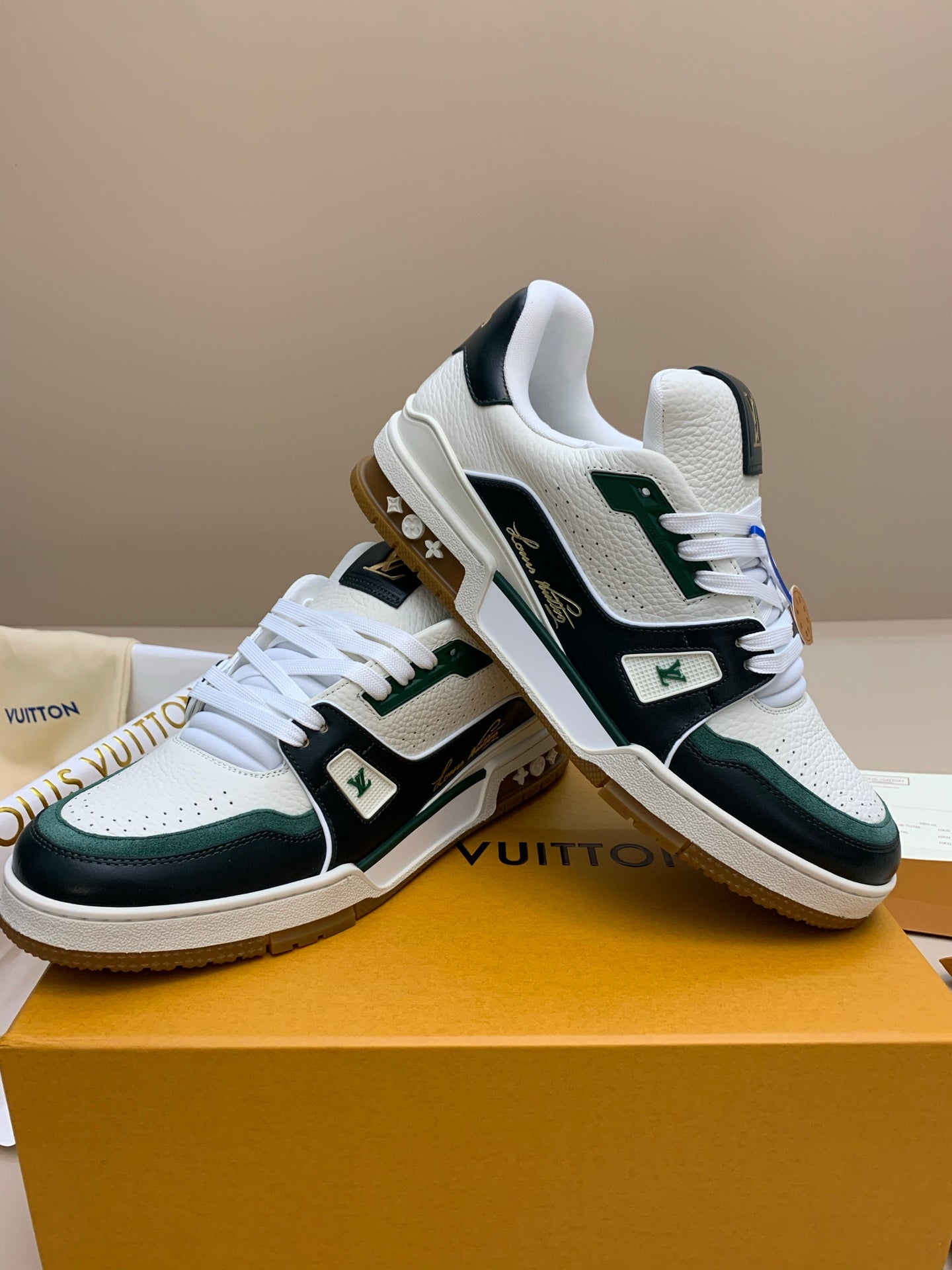 White and Black Leather Sneakers with Green Accents