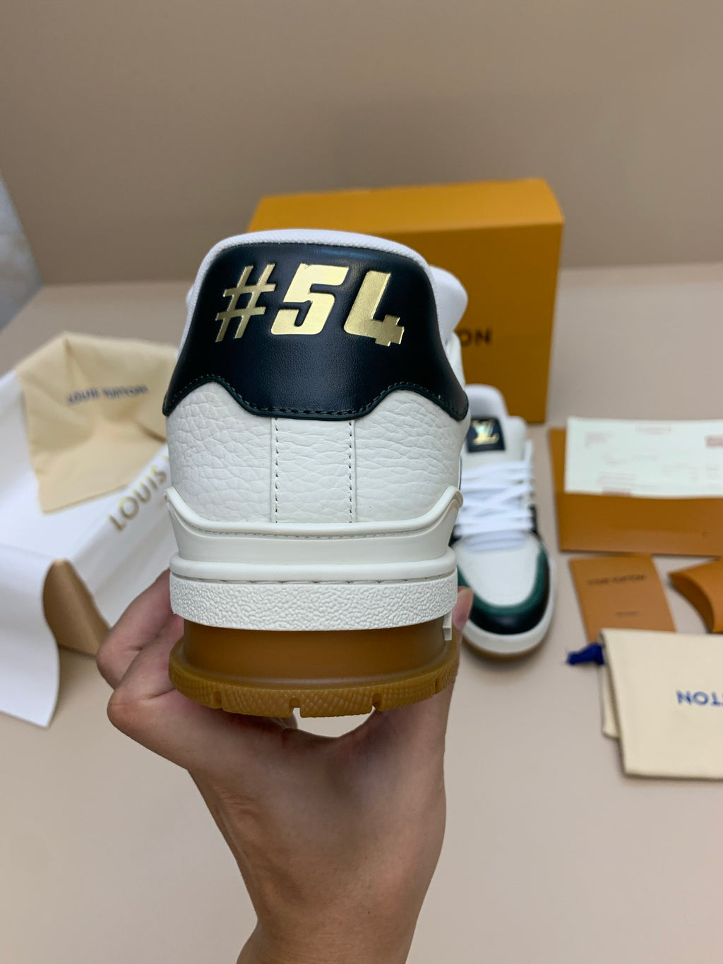 White and Black Leather Sneakers with Green Accents