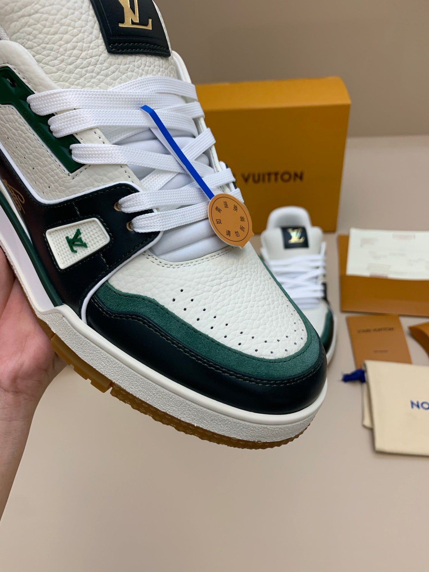 White and Black Leather Sneakers with Green Accents