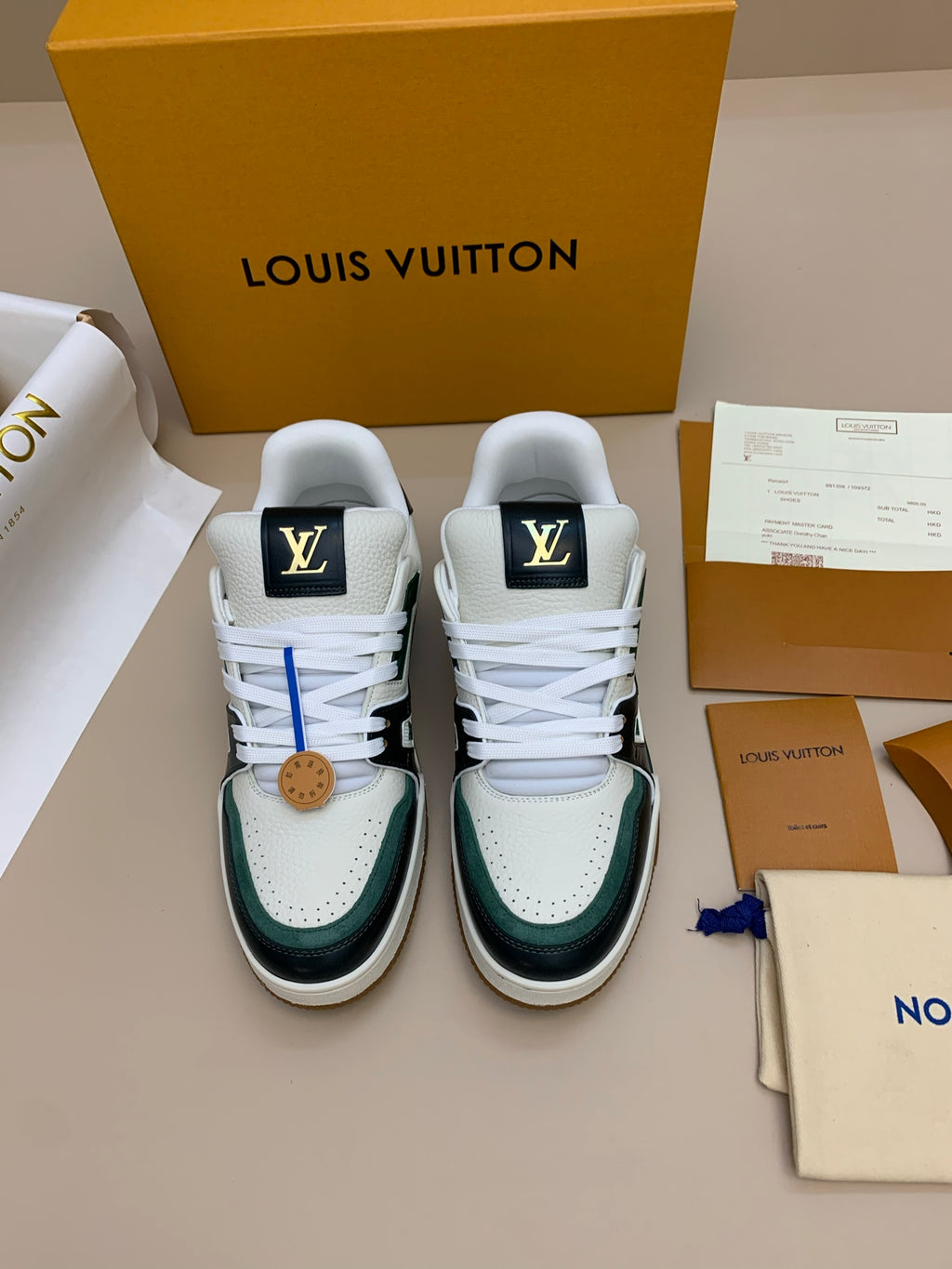 White and Black Leather Sneakers with Green Accents