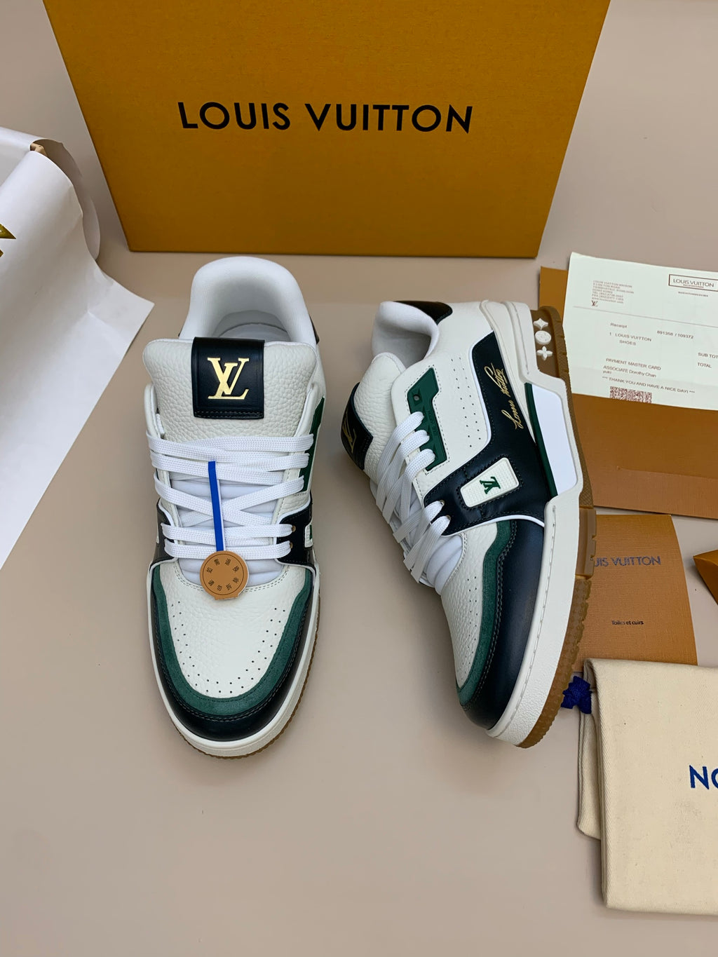 White and Black Leather Sneakers with Green Accents