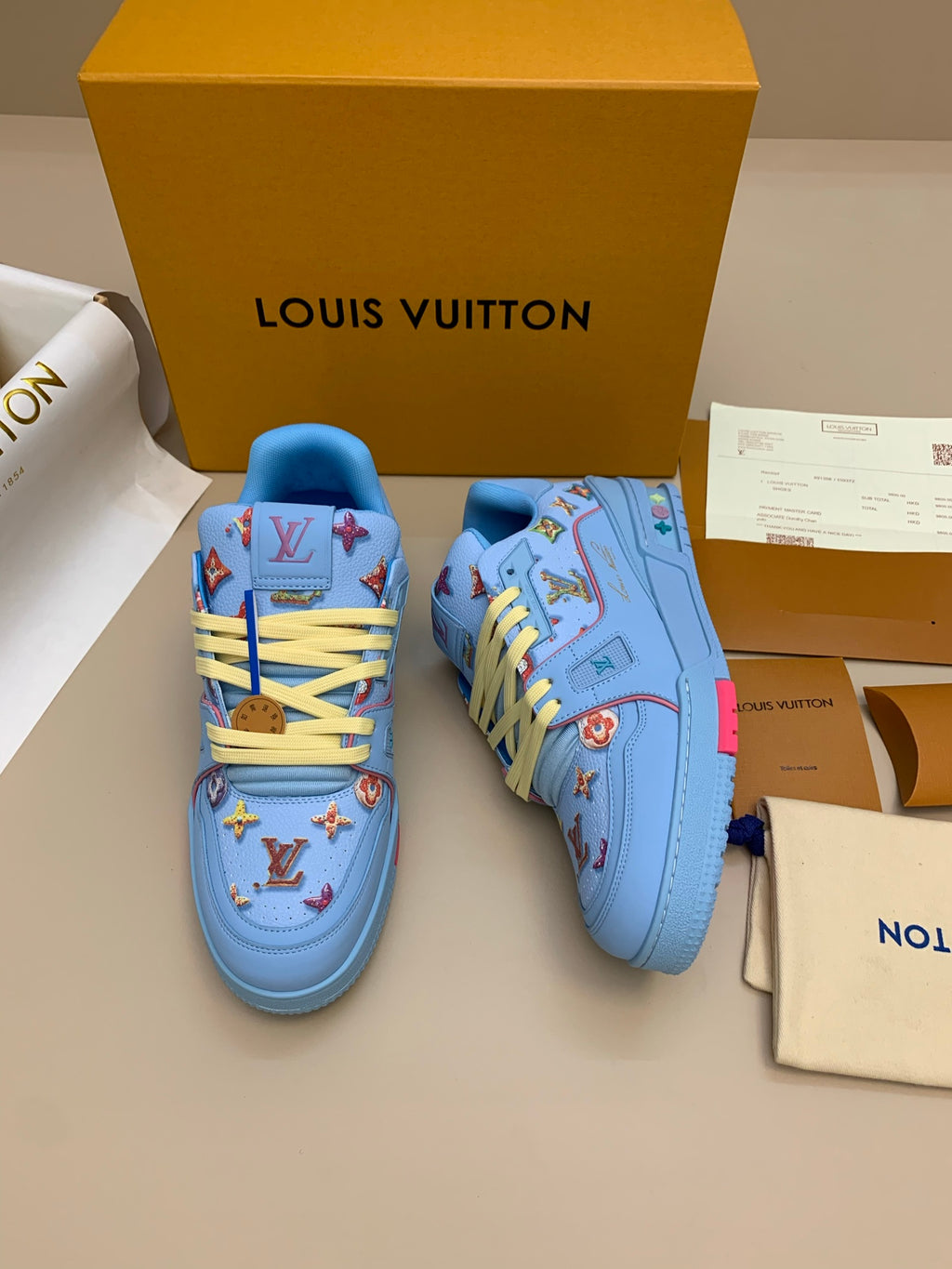 Light Blue Patterned Sneakers with Colorful Patches