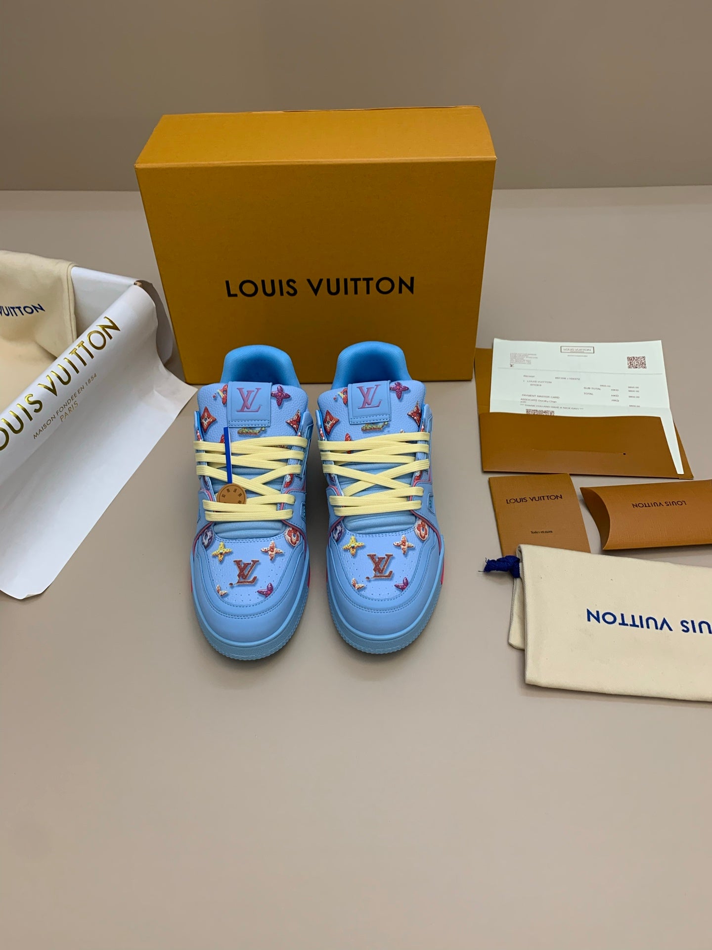 Light Blue Patterned Sneakers with Colorful Patches