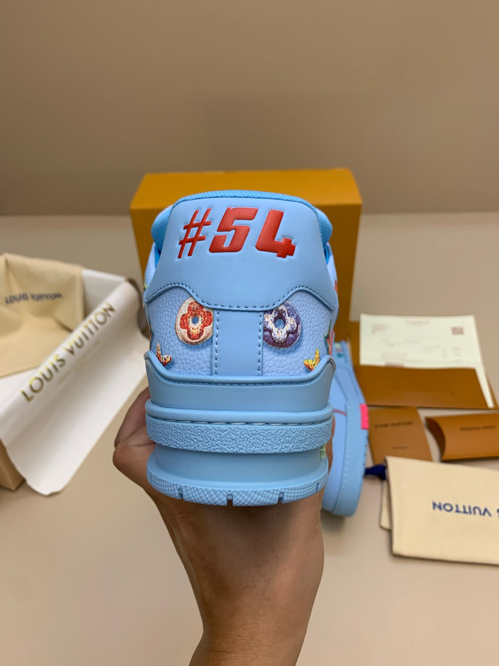 Light Blue Patterned Sneakers with Colorful Patches
