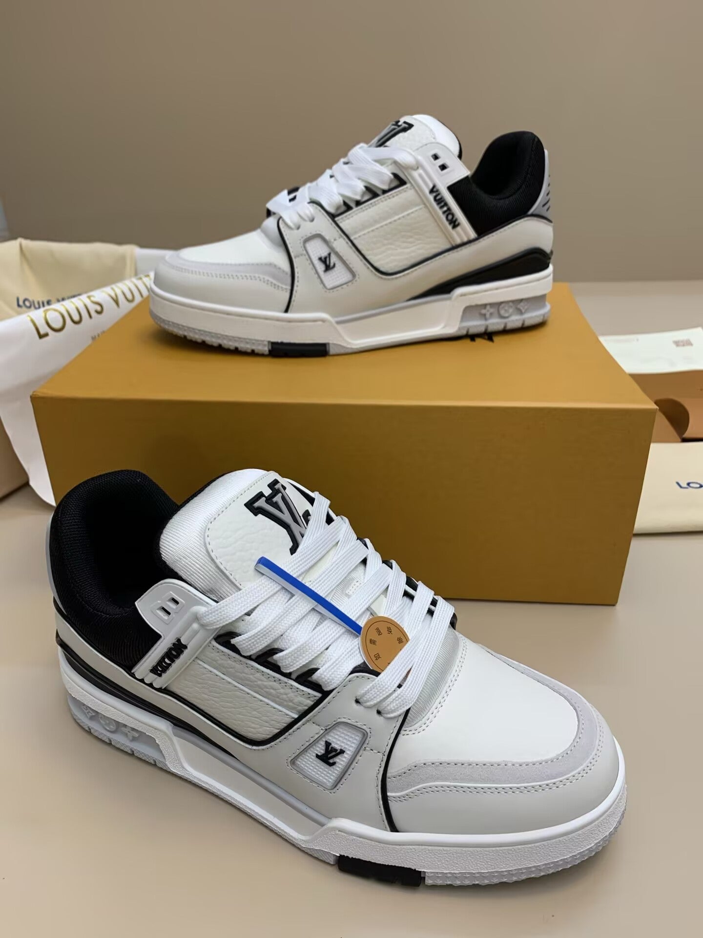 White leather sneakers with black accents