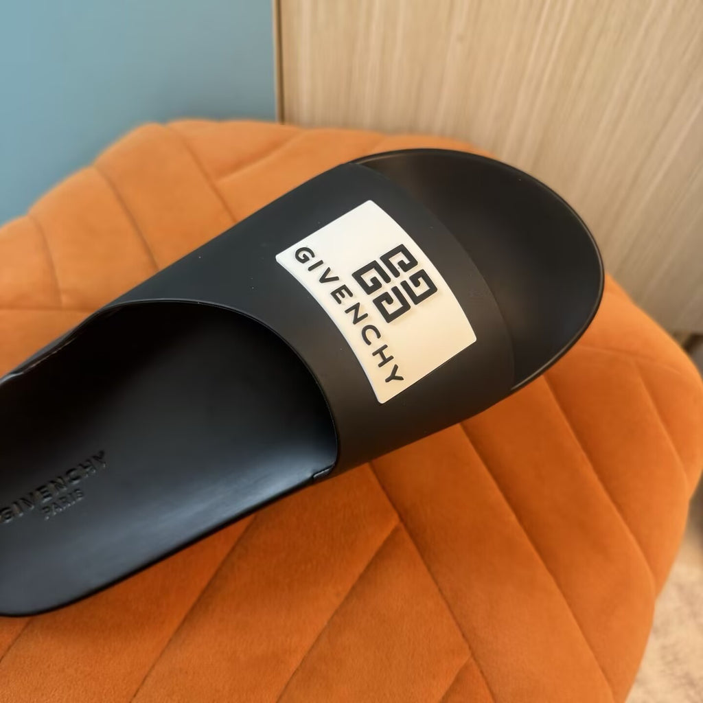 Black Slide Sandals with Orange Accent - Outsole view