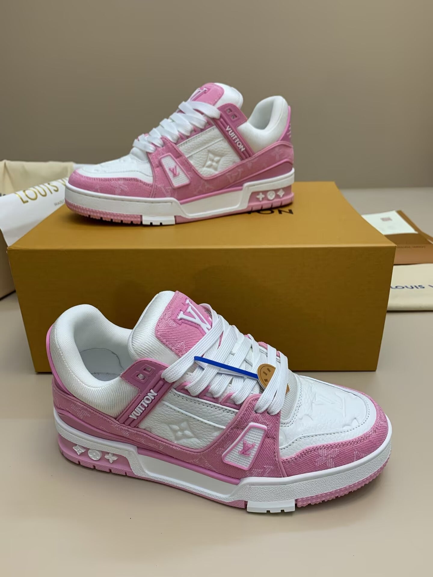 White and pink sneakers with patterned upper