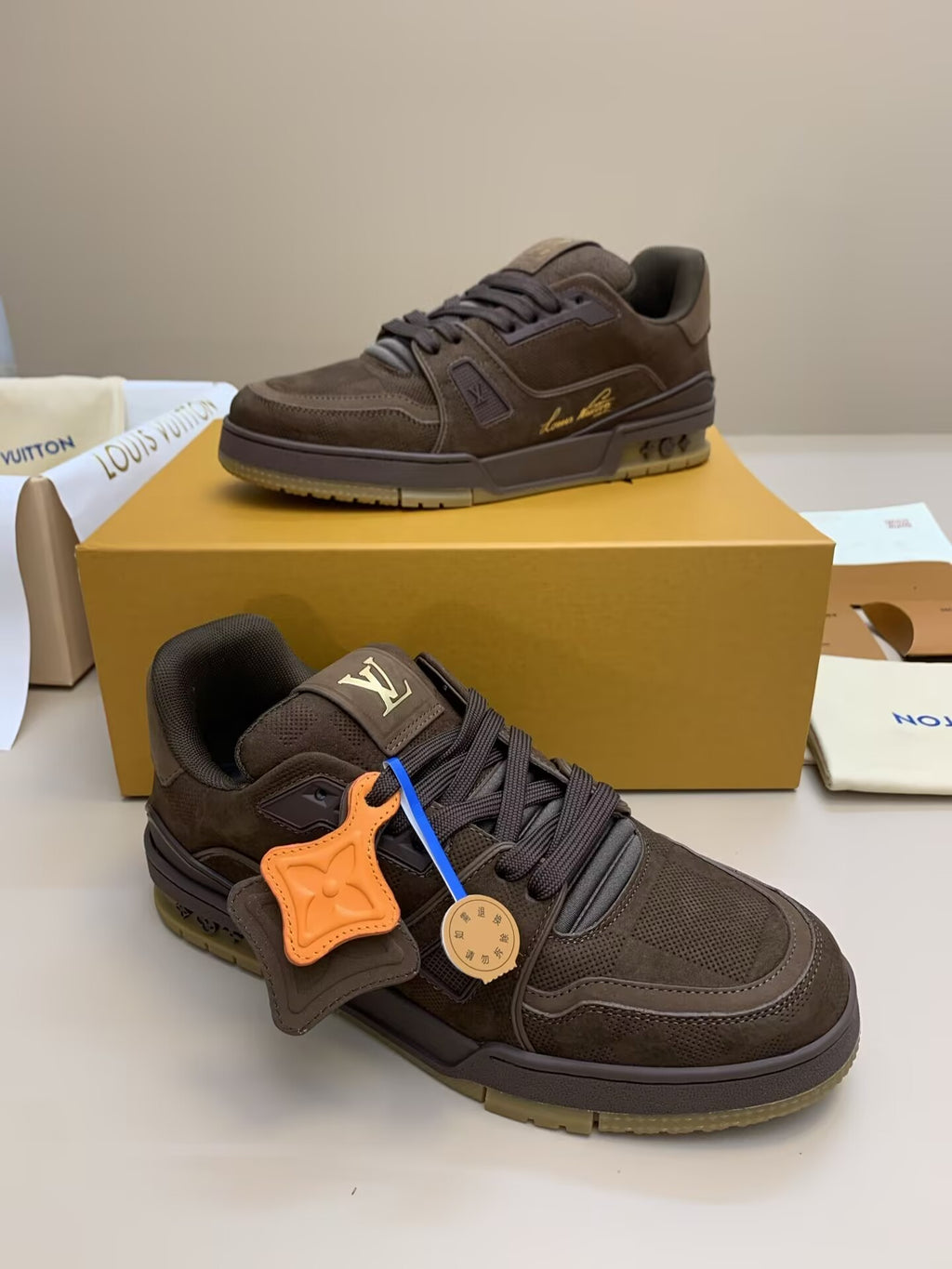 Brown suede and mesh sneaker with orange accents