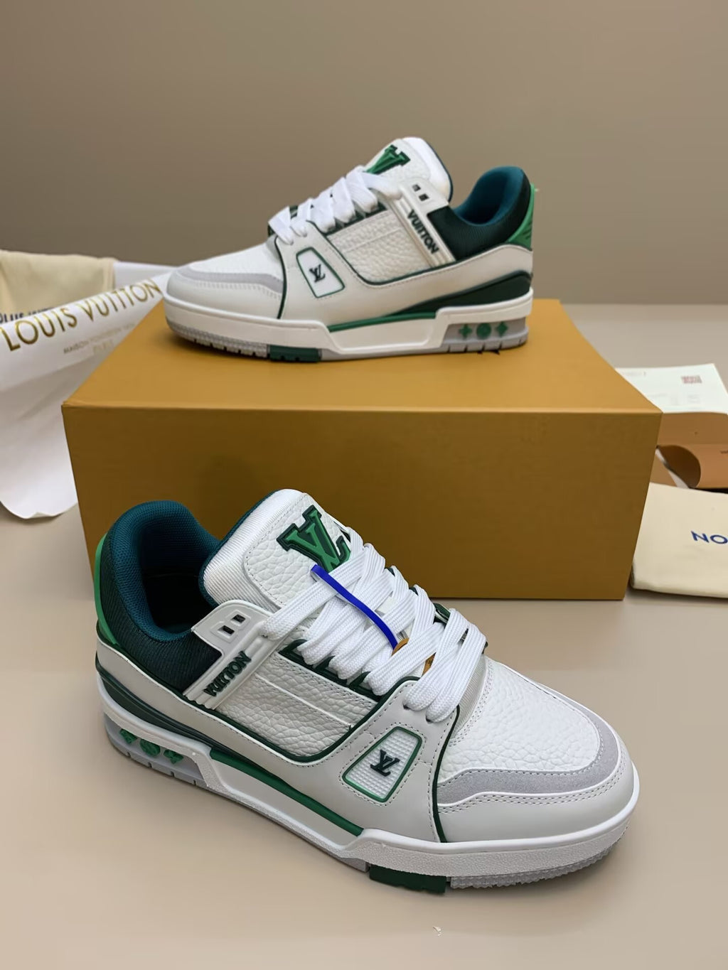 White and green lace-up sneakers with patterned upper