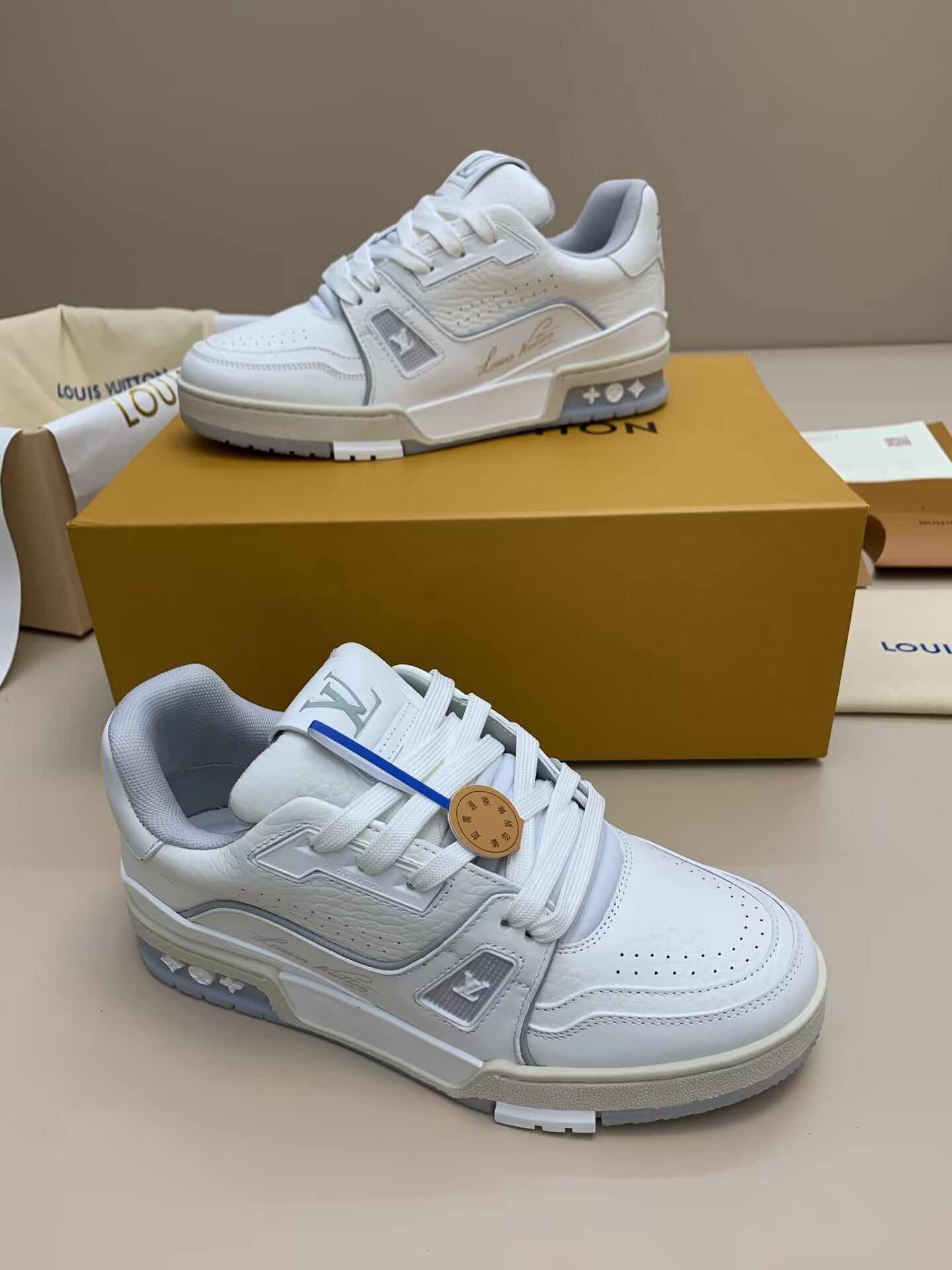 White casual sneakers with lace-up closure