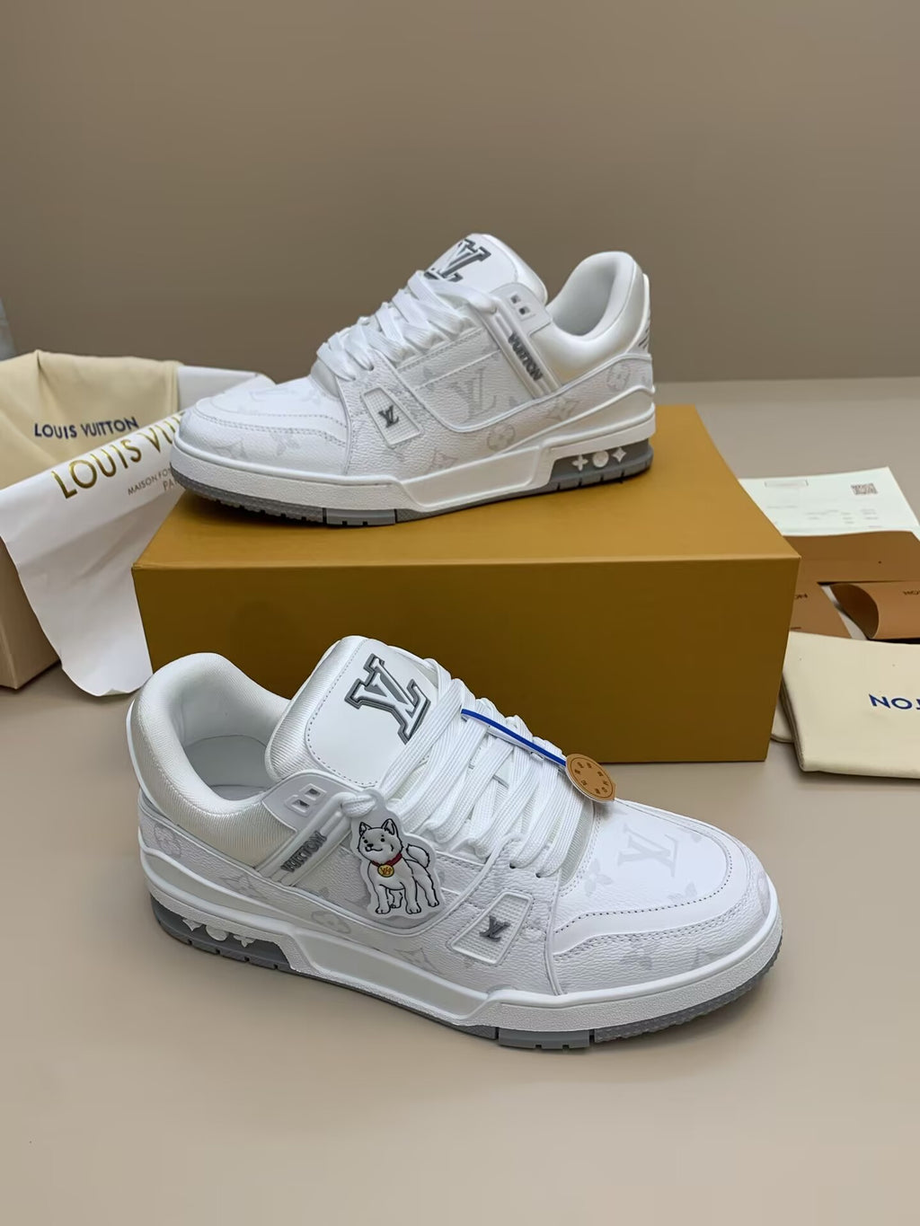 White and gray patterned casual sneakers with blue accents