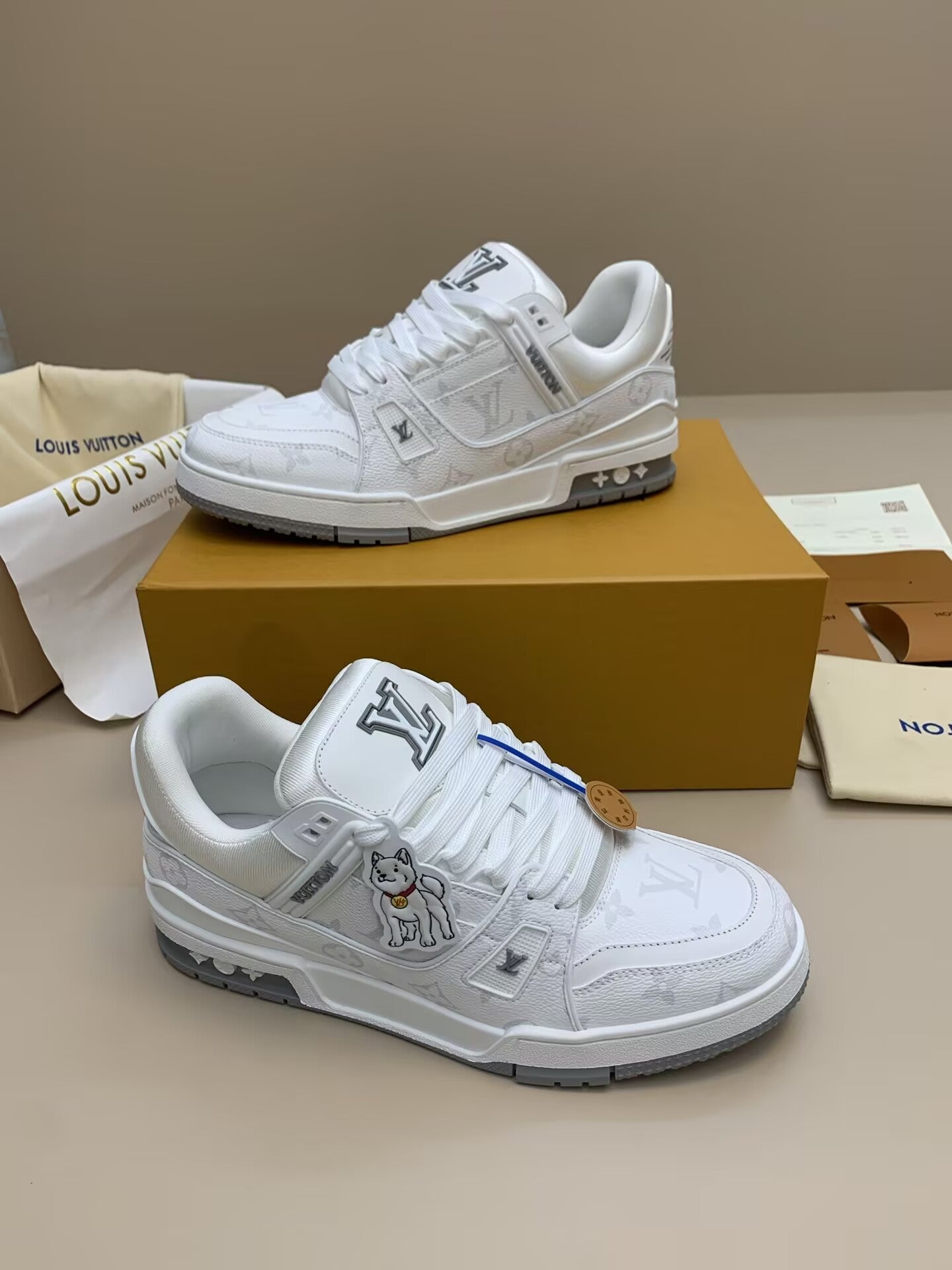 White and gray patterned casual sneakers with blue accents