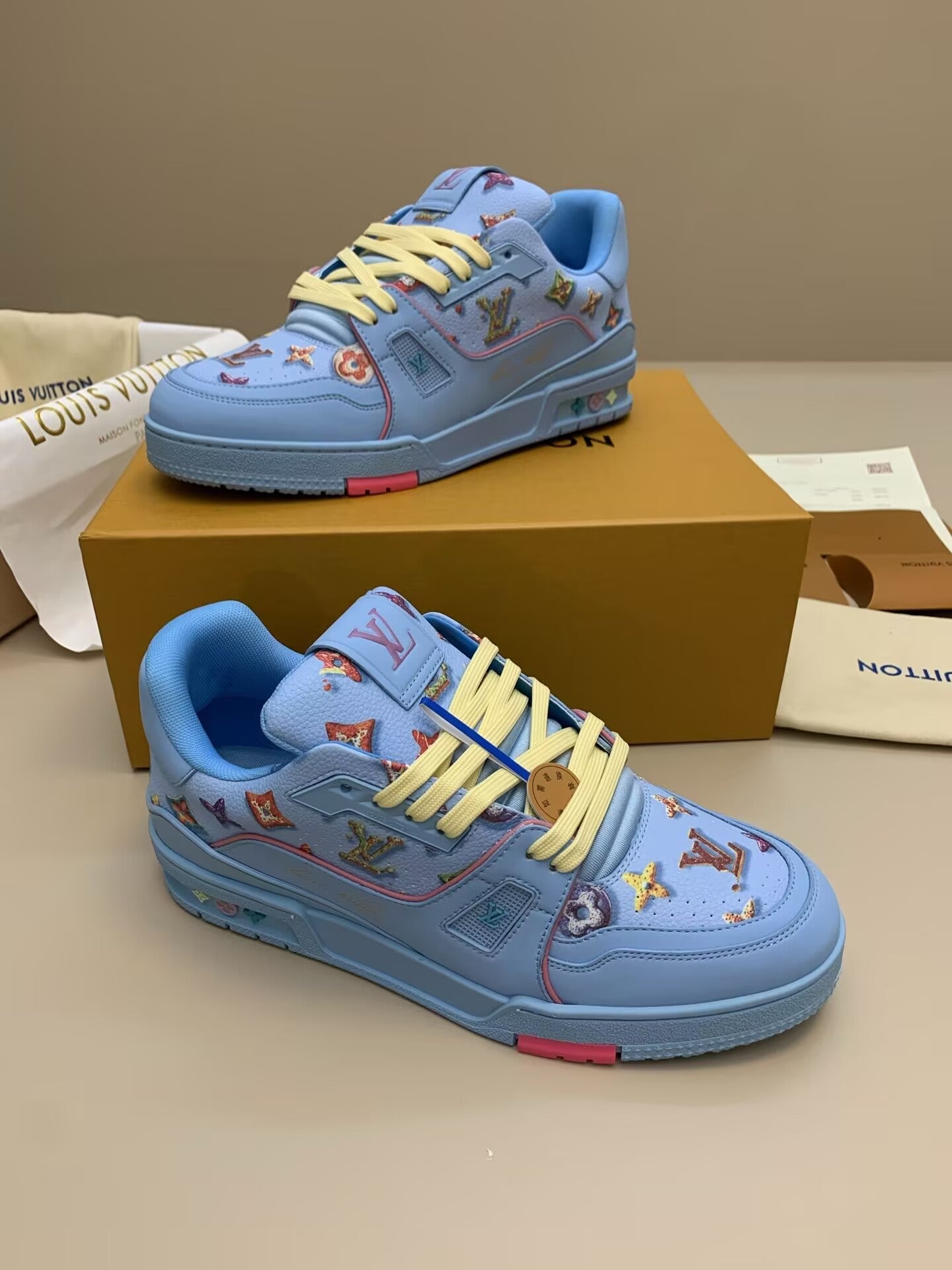 Light blue patterned sneakers with colorful patches